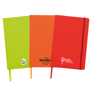 Group Notebooks In Green, Orange, Red With Clients Logos