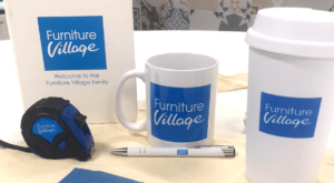 Onboarding pack for furniture village: branded tote, mug, coffee cup, tape measure, pen